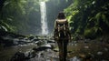 A woman trekker in the rain forest, in the rain, with difficulty