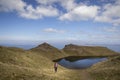 Woman trekking up to old man of storr on skye