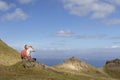 Woman trekking up to old man of storr on skye Royalty Free Stock Photo