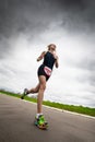 Woman triathlete runs during triathlon competition, bottom view.