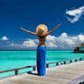 Woman on a beach jetty at Maldives Royalty Free Stock Photo