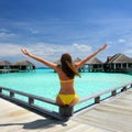 Woman on a beach jetty at Maldives Royalty Free Stock Photo