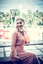 Woman with tropical mango juice outdoors, cafe. Bali island. Royalty Free Stock Photo