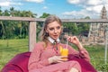 Woman with tropical mango juice outdoors, cafe. Bali island. Royalty Free Stock Photo