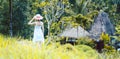 Woman in tropical vacation walking through the jungle