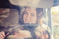 woman truck driver in the car. Girl smiling at camera and holding the steering wheel. Royalty Free Stock Photo