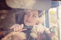 Woman truck driver in the car. Girl smiling at camera and holding the steering wheel. Royalty Free Stock Photo