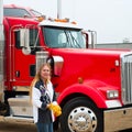 Woman Truck Driver Putting on her gloves Royalty Free Stock Photo