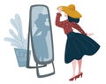 Woman trying on hat in front of mirror, fashion shopping