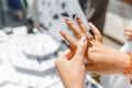 woman trying on her new ring at outdoor flea handmade market, jewelry and shopping concept