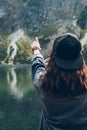 woman trying reach out the sky landscape view of lake at mountains