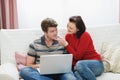 Woman trying to distract boyfriend from laptop