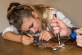 Woman trying to find problem in motherboard of computer Royalty Free Stock Photo