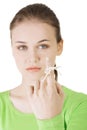 Woman trying to remember with the piece of string round her finger Royalty Free Stock Photo