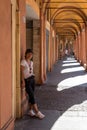 Woman in tshirt ,sneakers and black hat with sunglasses standing by The Portacoes Promanade Royalty Free Stock Photo