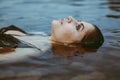 face girl lying in the water Royalty Free Stock Photo