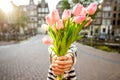 Woman with tulips in Amsterdam city Royalty Free Stock Photo