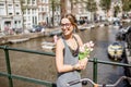Woman with tulips in Amsterdam city