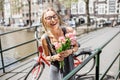 Woman with tulips in Amsterdam city Royalty Free Stock Photo