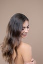 Woman turning around looking at her bare shoulder Royalty Free Stock Photo