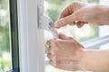 Close Up Of Woman Turning Key In Window Lock Royalty Free Stock Photo