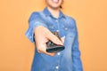 Woman turning off television holding tv remote control