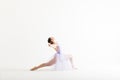 Woman In Tutu Performing A Dance Routine Over White Background