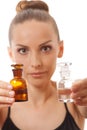 Woman with two bottles of medicine or perfume Royalty Free Stock Photo