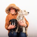 Woman with two dogs on lap Royalty Free Stock Photo