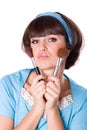 Woman with two make-up brushes