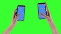 Woman with two smartphones is making zoom gestures on touchscreens with tracking markers