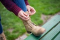 Woman is tying her boot Royalty Free Stock Photo