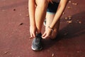 woman tying her shoes on running track. Jogging girl exercise motivation heatlhy fit living