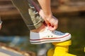 Woman tying laces in sneakers outdoors Royalty Free Stock Photo