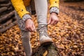 Woman tying shoelace on her hiking boot Royalty Free Stock Photo