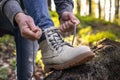 Woman tying shoelace on her hiking boot Royalty Free Stock Photo