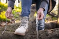 Woman tying shoelace on her hiking boot Royalty Free Stock Photo