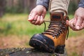 Woman tying shoelace on her hiking boot Royalty Free Stock Photo