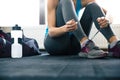 Woman tying shoelaces