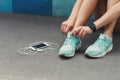 Woman tying shoes laces before running top view Royalty Free Stock Photo