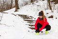 Woman tying sport shoes during winter Royalty Free Stock Photo