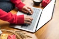 woman type on laptop at home. girl use computer during xmas. christmas holiday. new year celebration. season greetings Royalty Free Stock Photo