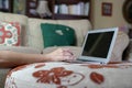Woman typing on her laptop at her home. Work from home or flexi work concept Royalty Free Stock Photo