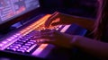 Woman typing on keyboard close-up view with cinematic lighting colors purple and orange