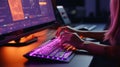 Woman typing on keyboard close-up view with cinematic lighting colors purple and orange