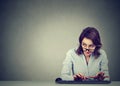 Woman typing on the keyboard wondering what to reply Royalty Free Stock Photo