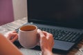 Woman typing on laptop