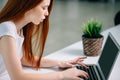 Woman typing on laptop at workplace Woman working in home office hand keyboard Royalty Free Stock Photo