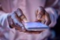 Woman typing on mobile phone late in the evening Royalty Free Stock Photo