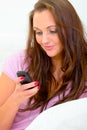 Woman typing text sms message on her mobile Royalty Free Stock Photo